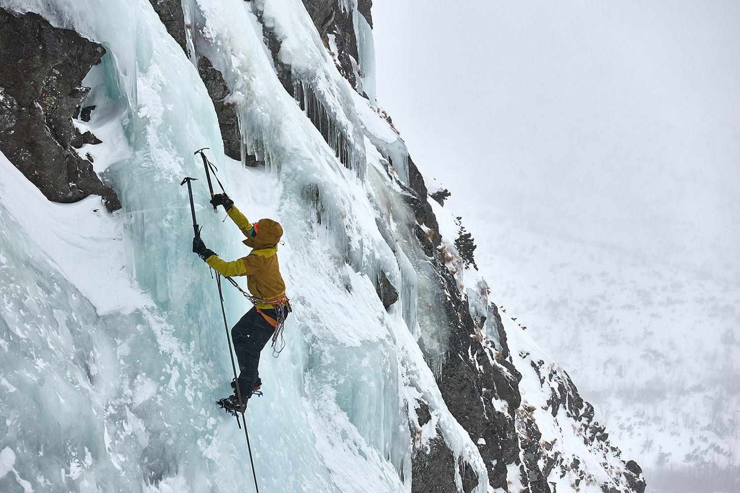 A,Iceclimber,Is,Climbing,The,Icefall,With,An,Ice,Axes