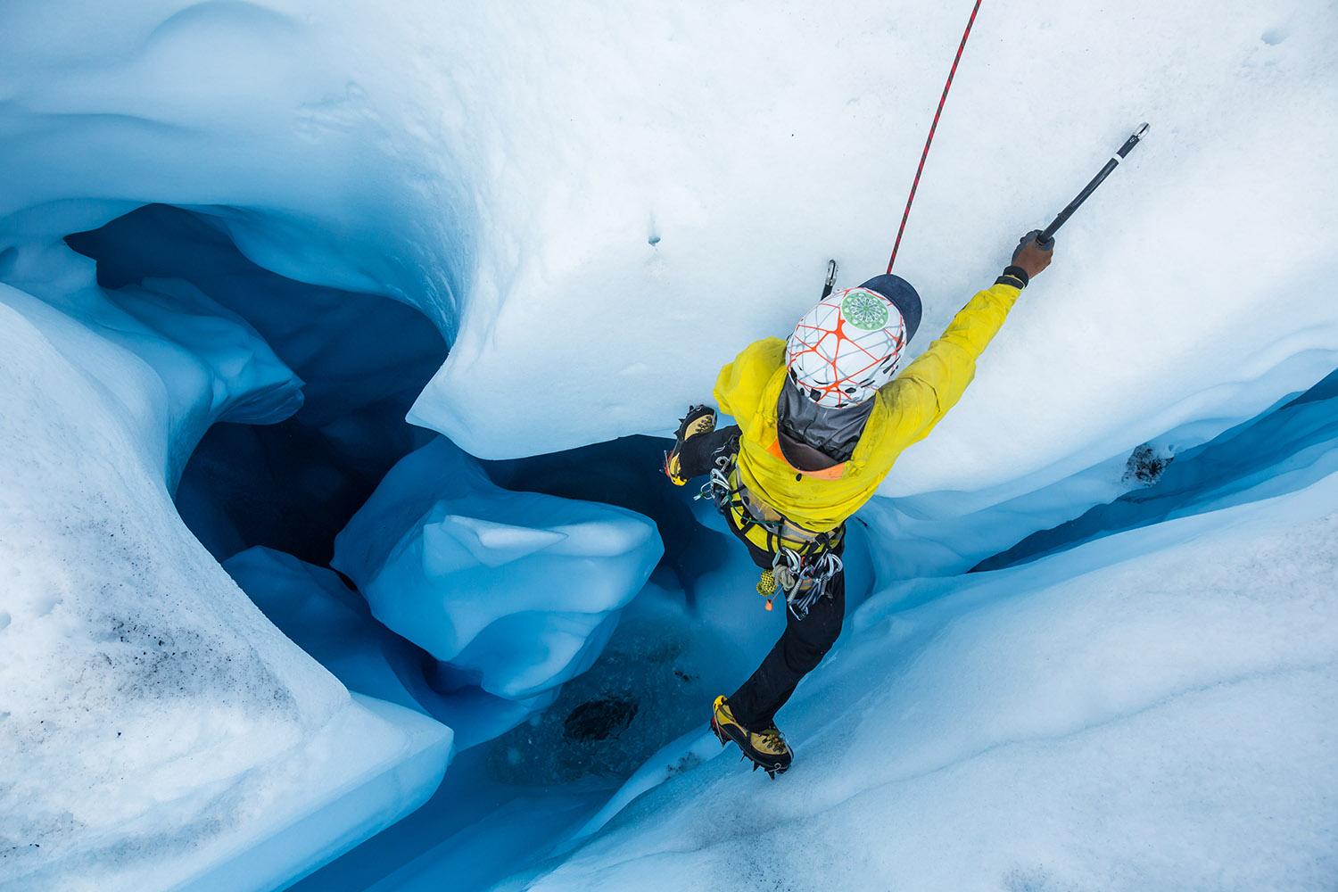 Ice,Climber,From,Above,As,He,Climbs,Out,Of,A