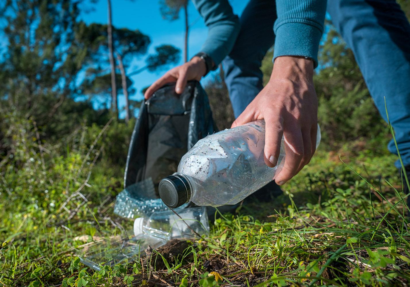 Man,Cleaning-up,The,Forest,Of,Plastic,Garbage.,Nature,Cleaning.,Volunteer