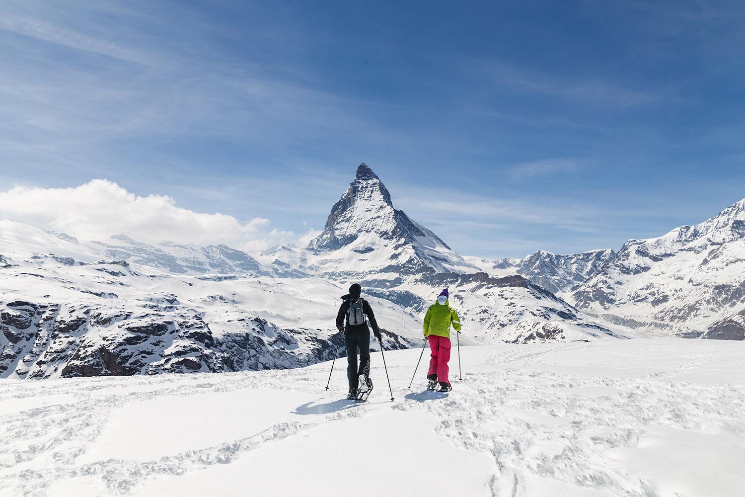 Men,Walking,On,Ski,In,The,Background,Of,Matterhorn,,Zermatt,