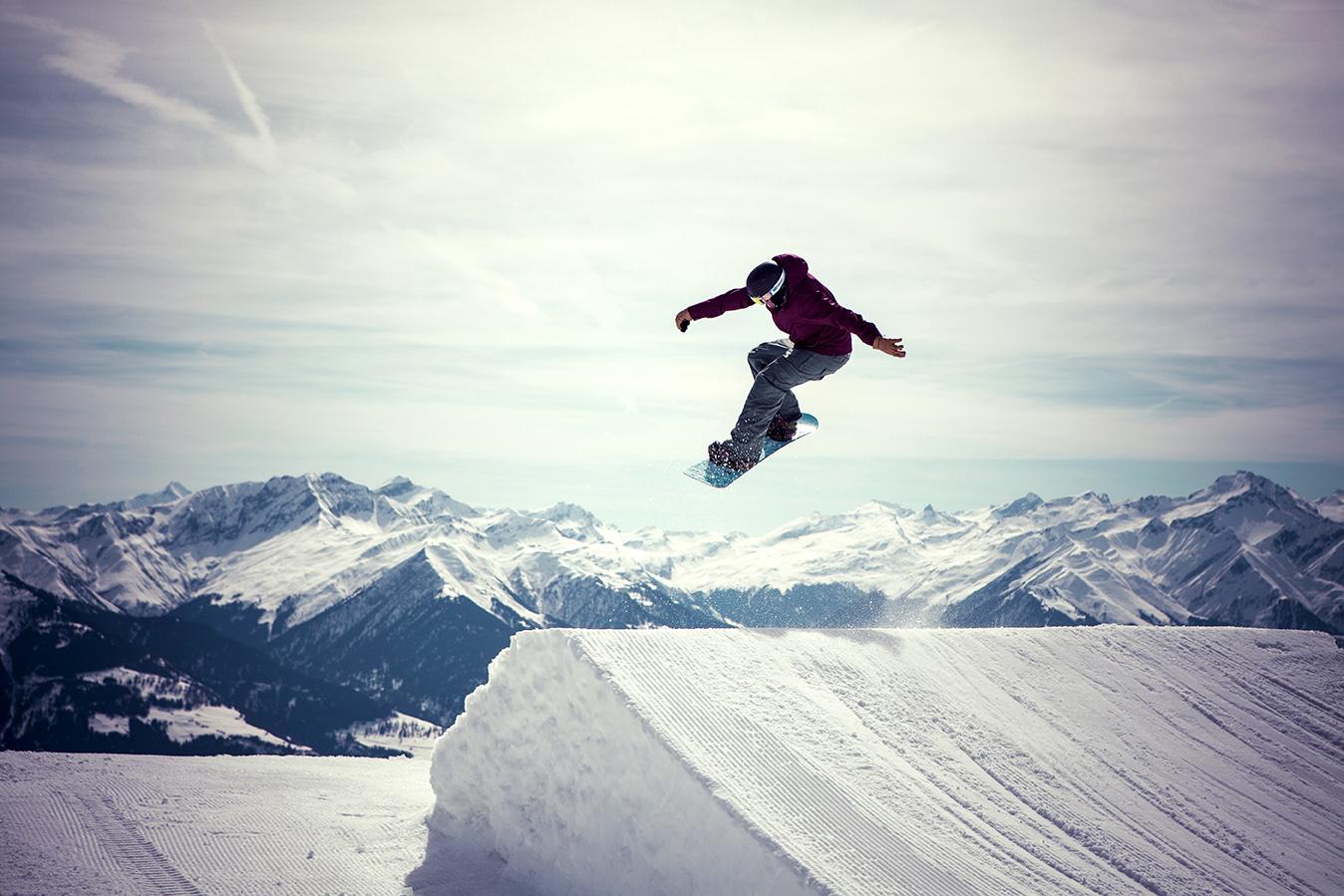 Snowboarder,Jumps,A,180,In,Laax
